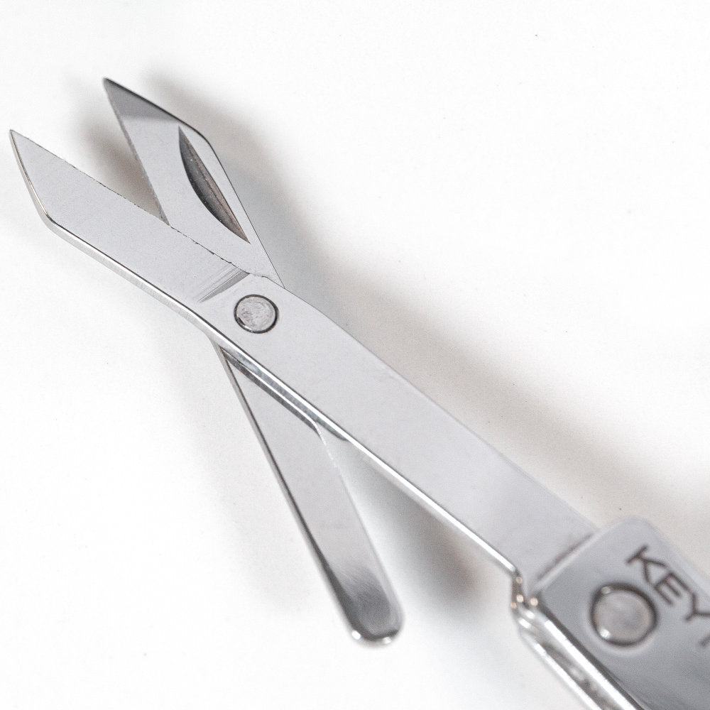 Miniature folding stainless steel scissors on keychain
