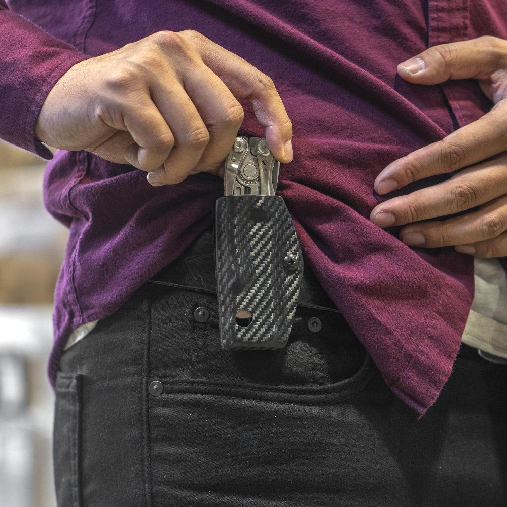 Clip and Carry Kydex Sheath for the Leatherman Skeletool Clipped to a Belt
