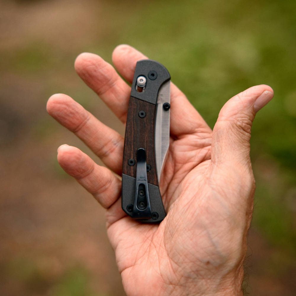 Buck 112 Folding Ranger Crossbar Knife in Hand, Closed Clip Side View