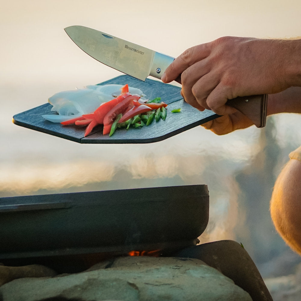 Messermeister Adventure Chef 6-inch Folding Chef's Knife in Use by the Campfire