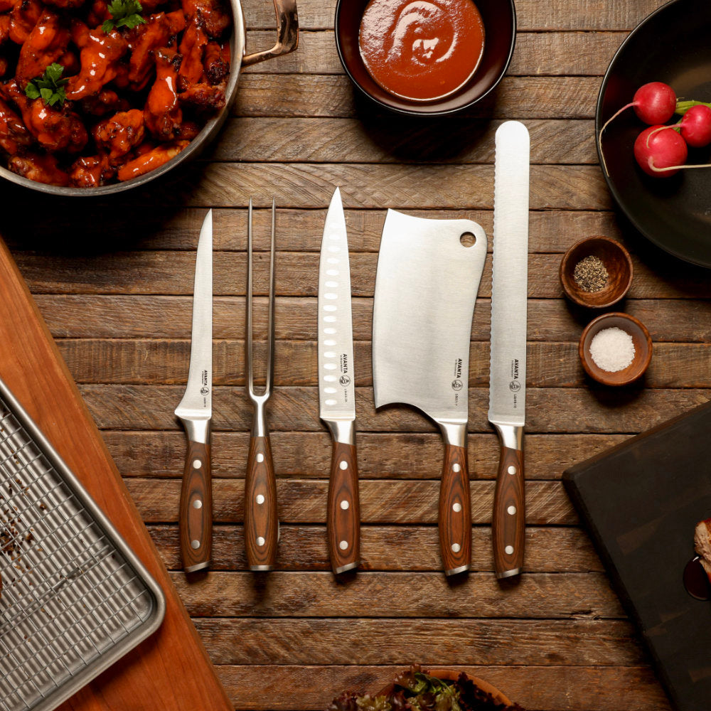 Messermeister Avanta Forged 6-Piece Pro BBQ Set Laid Out with BBQ Feast