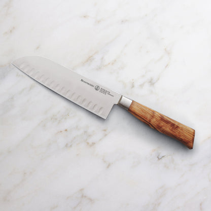 Messermeister Oliva Elite 7-inch Kullens Santoku Knife on Marble Counter
