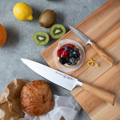 Messermeister Oliva Elite 3.5-inch Paring Knife on Board with Chef's Knife and Fruit