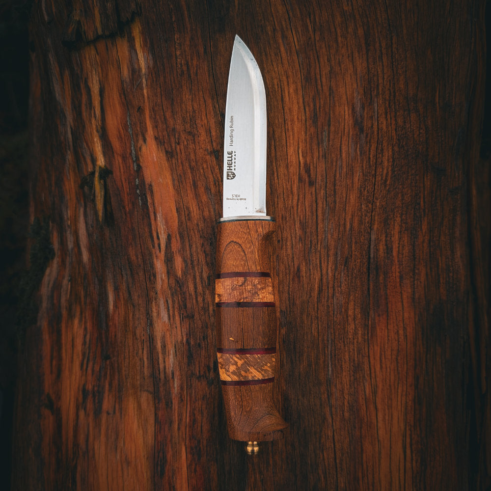 Helle Harding Rubin 2026 Limited Edition Outdoor Knife on Beech Wood Background