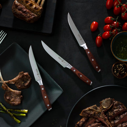 Messermeister Avanta Forged 4-Piece Steak Knife Set on Table with Lamb and Steak