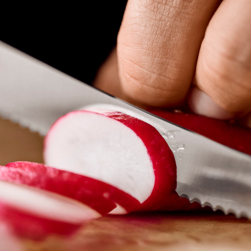 Victorinox Swiss Classic 4.5" Serrated Round Tip Paring Knife in Use