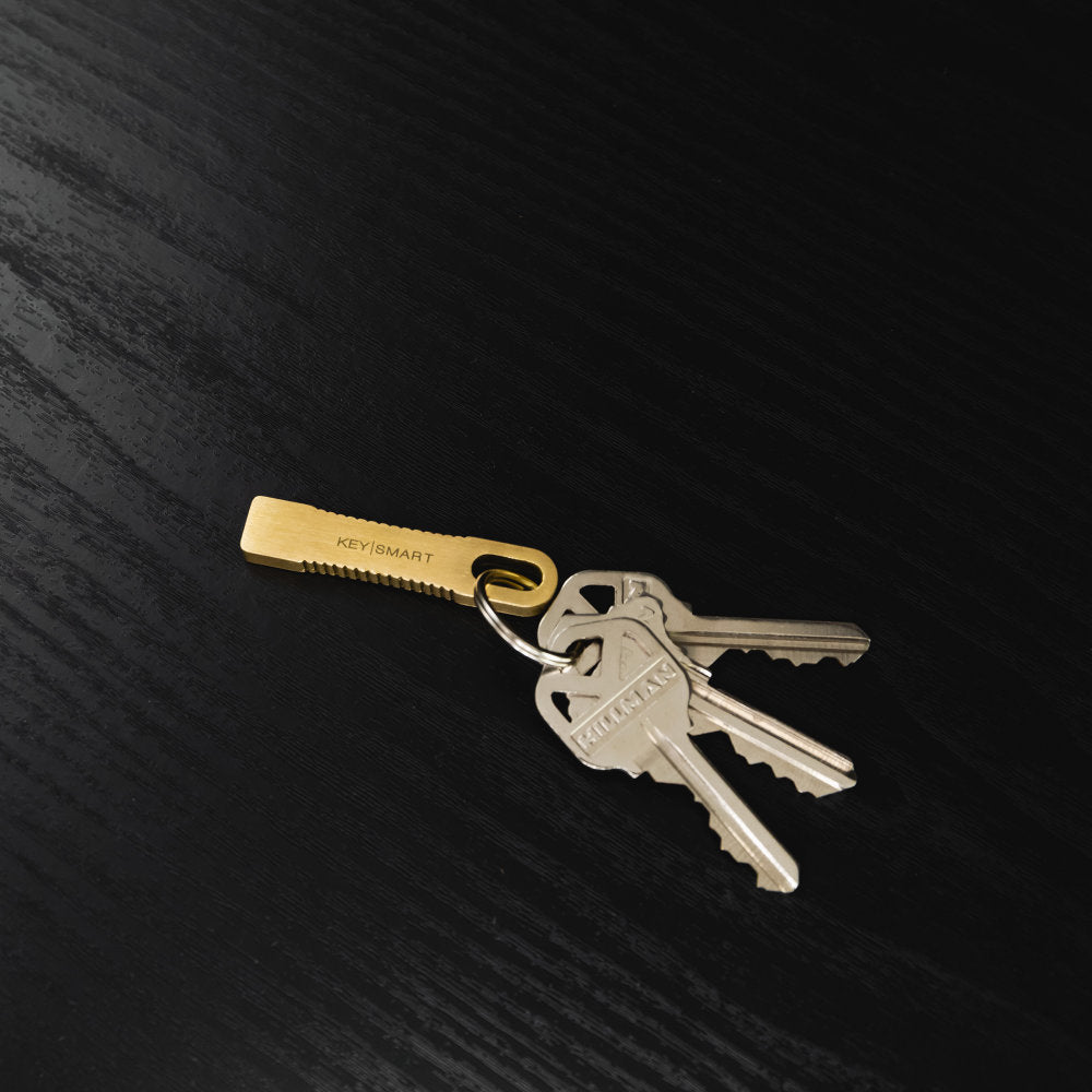 CleanKey Mini Brass Tool by KeySmart on a Key Chain